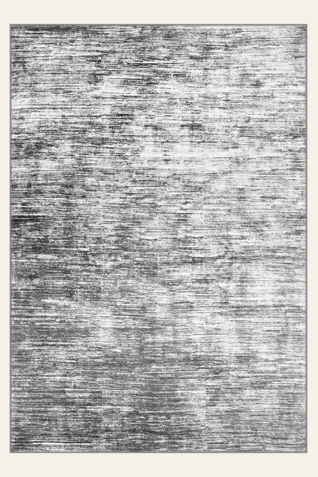 Aegean Wash Grey washable rug, a soft stonewashed grey that shifts with the light