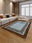 Desert Frame rectangular washable rug styled in a modern living space