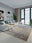 Mocha Fade washable area rug in a styled room, rectangular, low-pile cotton blend