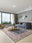 Navy Rosette washable area rug in a styled room, rectangular, low-pile cotton blend
