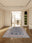 Navy Rosette rectangular washable rug styled in a modern living space