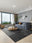 Patchwork Noir washable area rug in a styled room, rectangular, low-pile cotton blend