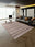 Rosewood Stripe rectangular washable rug styled in a modern living space