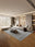 Sage Whisper washable area rug in a styled room, rectangular, low-pile cotton blend