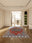 Serapi Flame rectangular washable rug styled in a modern living space